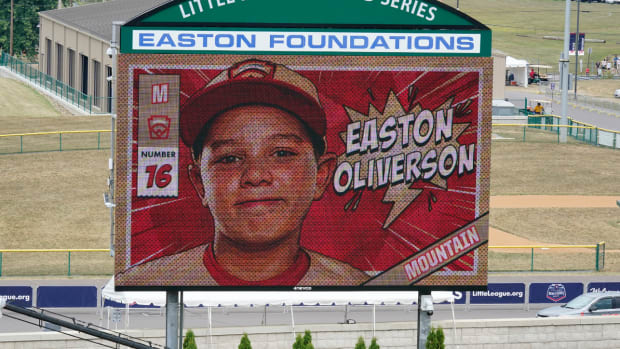 A picture of Mountain Region Champion Little League team member Easton Oliverson, from Santa Clara, Utah, is shown on the scoreboard at Volunteer Stadium during the opening ceremony of the 2022 Little League World Series baseball tournament in South Williamsport, Pa., Wednesday, Aug 17, 2022. Oliverson was injured when he fell out of a bunk bed at the dormitory complex. (AP Photo/Gene J. Puskar)
