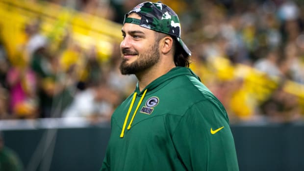 Green Bay Packers tackle David Bakhtiari (69) smiles as fans during Packers Family Night on Friday, Aug. 5, 2022, at Lambeau Field in Green Bay, Wis. Samantha Madar/USA TODAY NETWORK-Wis. Gpg Family Night 08052022 00034
