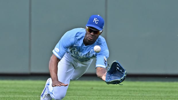 Aug 22, 2022; Kansas City, Missouri, USA; Kansas City Royals center fielder Michael A. Taylor (2) makes a diving attempt on the ball during the fourth inning against the Chicago White Sox at Kauffman Stadium. Mandatory Credit: Peter Aiken-USA TODAY Sports