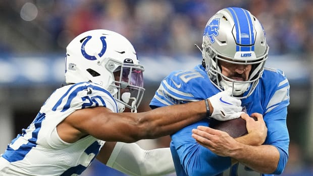 Detroit Lions quarterback David Blough (10) rushes up the Indianapolis Colts safety Nick Cross (20) on Saturday, August 20, 2022 at Lucas Oil Stadium in Indianapolis. The Indianapolis Colts and Detroit Lions are tied at the half, 13-13. Nfl Detroit Lions At Indianapolis Colts