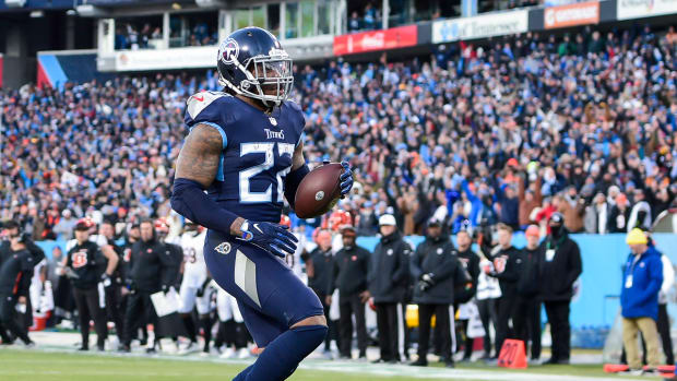 Tennessee Titans running back Derrick Henry (22) scores a touchdown against the Cincinnati Bengals during the first half during a AFC Divisional playoff football game at Nissan Stadium.