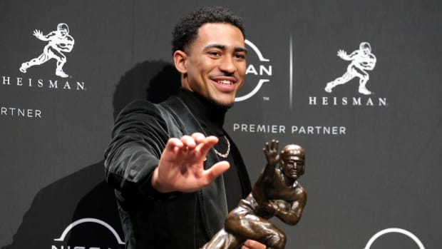 2021 Heisman winner Alabama quarterback Bryce Young poses for pictures with the trophy during a press conference at the New York Marriott Marquis in New York City.
