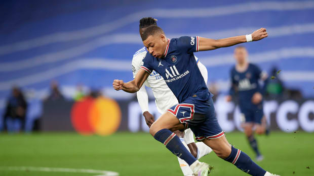 Kylian Mbappe pictured sprinting with the ball during PSG's Champions League game against Real Madrid in Spain in March 2022