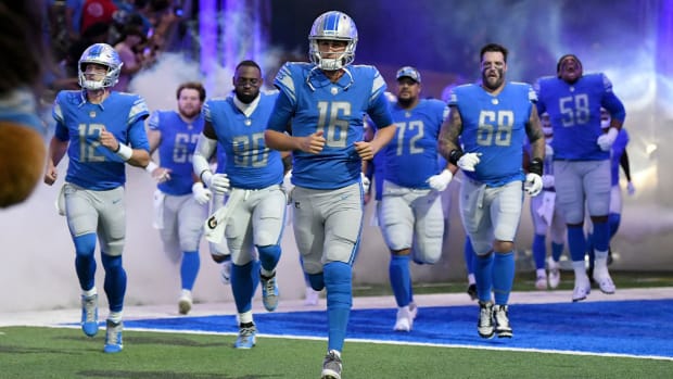 Aug 12, 2022; Detroit, Michigan, USA; Detroit Lions quarterback Jared Goff (16) leads the team onto the field for their preseason game against the Atlanta Falcons at Ford Field.
