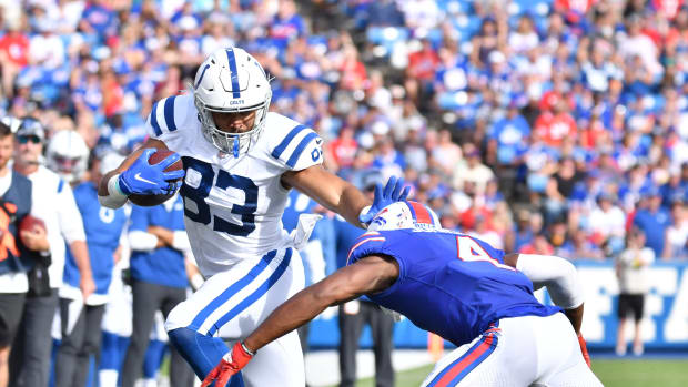 Aug 13, 2022; Orchard Park, New York, USA; Indianapolis Colts tight end Kylen Granson (83) gives a stiff-arm to Buffalo Bills safety Jaquan Johnson (4) in the second quarter pre-season game at Highmark Stadium. Mandatory Credit: Mark Konezny-USA TODAY Sports