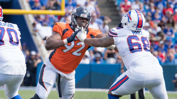 Denver Broncos defensive tackle Jonathan Harris (92) with Buffalo Bills tackle Bobby Hart (68) in the third quarter of a pre-season game at Highmark Stadium.