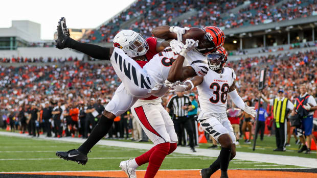 Aug 12, 2022; Cincinnati, Ohio, USA; Cincinnati Bengals safety Dax Hill (23) attempts to intercept the pass intended for Arizona Cardinals tight end Chris Pierce Jr. (49) in the first half at Paycor Stadium. Mandatory Credit: Katie Stratman-USA TODAY Sports