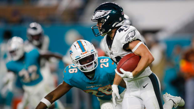 Philadelphia Eagles wide receiver Britain Covey (41) runs with the football ahead of Miami Dolphins running back Salvon Ahmed (26) during the fourth quarter at Hard Rock Stadium.