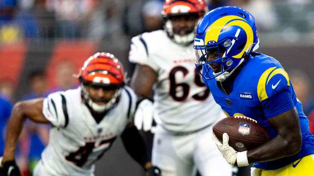Los Angeles Rams quarterback Bryce Perkins (16) runs downfield against the Cincinnati Bengals in the fourth quarter of a preseason game at Paycor Stadium.