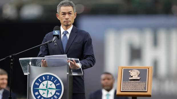 Former Seattle Mariners player Ichiro Suzuki speaks as he is inducted into the Mariners Hall of Fame during a ceremony before a baseball game between the Mariners and the Cleveland Guardians, Saturday, Aug. 27, 2022, in Seattle. (AP Photo/John Froschauer)