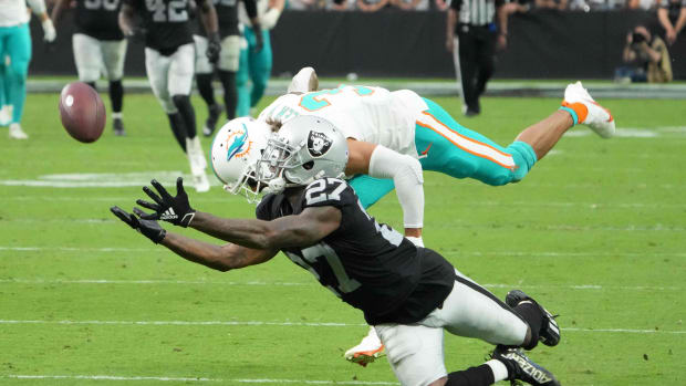 Sep 26, 2021; Paradise, Nevada, USA; Las Vegas Raiders cornerback Trayvon Mullen (27) breaks up a pass intended for Miami Dolphins wide receiver Will Fuller (3) in overtime at Allegiant Stadium.The Raiders defeated the Dolphins 31-28 in overtime.