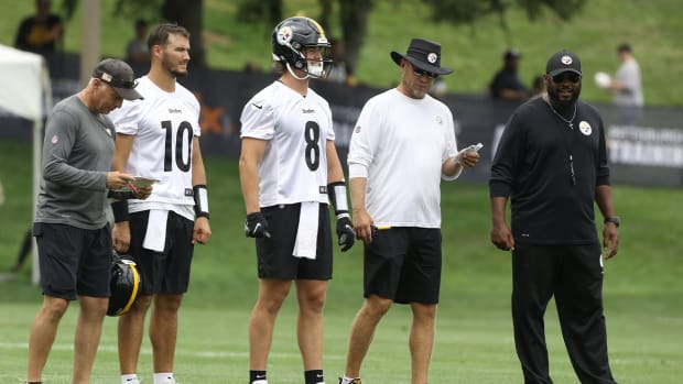 Jul 27, 2022; Latrobe, PA, USA; Pittsburgh Steelers quarterbacks coach Mike Sullivan (left) and quarterbacks Mitch Trubisky (10) and Kenny Pickett (8) and offensive coordinator Matt Canada (in white) and head coach Mike Tomlin (right) participate in training camp at Chuck Noll Field.