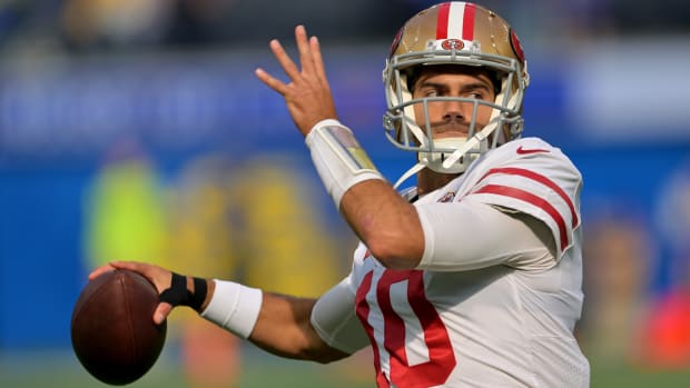 49ers quarterback Jimmy Garoppolo warms up before a game.