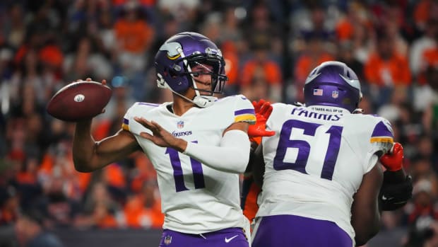 Aug 27, 2022; Denver, Colorado, USA; Minnesota Vikings quarterback Kellen Mond (11) prepares to pass in the second half against the Denver Broncos at Empower Field at Mile High. Mandatory Credit: Ron Chenoy-USA TODAY Sports