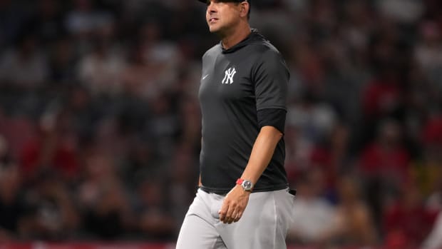New York Yankees manager Aaron Boone walks off field in Angel Stadium