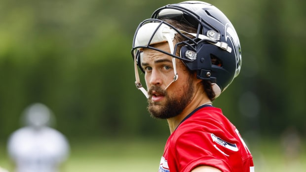 Seahawks quarterback Jacob Eason looks at the camera with his helmet off during a training camp practice.