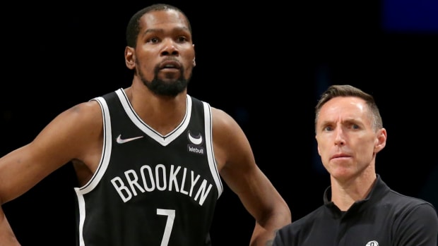 Brooklyn Nets head coach Steve Nash and forward Kevin Durant (7) watch during the fourth quarter against the Detroit Pistons on March 29, 2022.