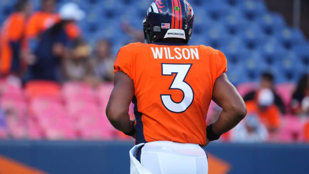 Denver Broncos quarterback Russell Wilson (3) warms up before a preseason game against the Minnesota Vikings at Empower Field at Mile High.