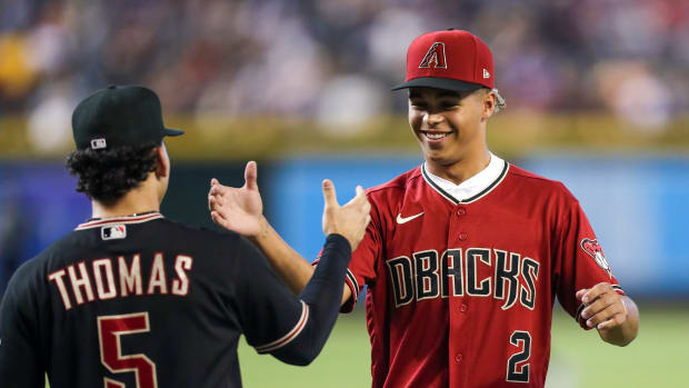 Druw Jones (2) high-fives Alek Thomas (5), while Jones meets all the players on the Diamondbacks big league roster after signing his first professional contract.
