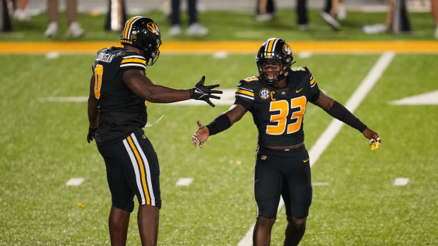 Sep 1, 2022; Columbia, Missouri, USA; Missouri Tigers defensive lineman Jayden Jernigan (0) celebrates with linebacker Chad Bailey (33) after a sack against the Louisiana Tech Bulldogs during the second half at Faurot Field at Memorial Stadium. Mandatory Credit: Jay Biggerstaff-USA TODAY Sports