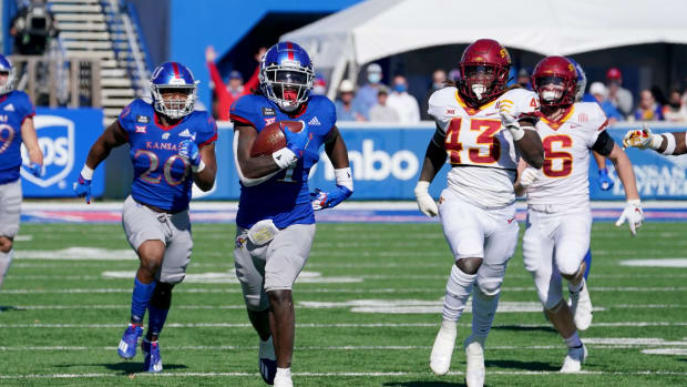 Oct 31, 2020; Lawrence, Kansas, USA; Kansas Jayhawks safety Kenny Logan Jr. (1) returns a kickoff for a touchdown during the second half against the Iowa State Cyclones at David Booth Kansas Memorial Stadium. Mandatory Credit: Denny Medley-USA TODAY Sports