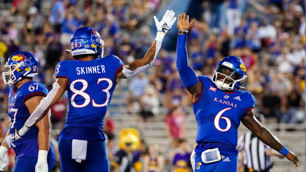 Sep 2, 2022; Lawrence, Kansas, USA; Kansas Jayhawks quarterback Jalon Daniels (6) celebrates with wide receiver Quentin Skinner (83) after scoring a touchdown against the Tennessee Tech Golden Eagles during the first half at David Booth Kansas Memorial Stadium.