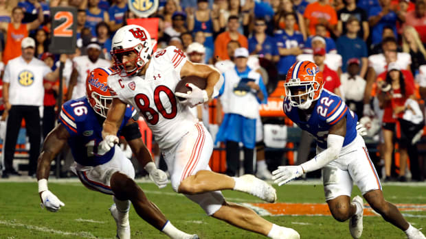 Utah Utes tight end Brant Kuithe (80) runs with the ball against the Florida Gators during the second quarter at Steve Spurrier-Florida Field.