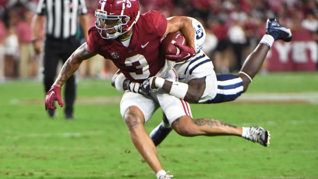 Alabama Crimson Tide wide receiver Jermaine Burton (3) runs the ball after catching a pass against the Utah State Aggies at Bryant-Denny Stadium. Alabama won 55-0.