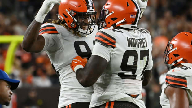 Aug 27, 2022; Cleveland, Ohio, USA; Cleveland Browns defensive end Alex Wright (94) and defensive tackle Perrion Winfrey (97) celebrate after Winfrey recovered a fumble during the first half against the Chicago Bears at FirstEnergy Stadium. Mandatory Credit: Ken Blaze-USA TODAY Sports