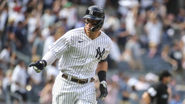 New York Yankees OF Aaron Judge points to dugout after home run