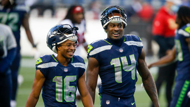Nov 1, 2020; Seattle, Washington, USA; Seattle Seahawks wide receiver Tyler Lockett (16) and wide receiver DK Metcalf (14) return to the locker room following a 37-27 victory against the San Francisco 49ers at CenturyLink Field. Mandatory Credit: Joe Nicholson-USA TODAY Sports