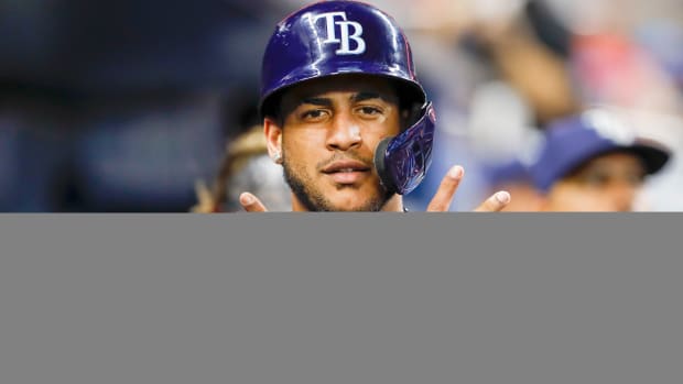 Aug 30, 2022; Miami, Florida, USA; Tampa Bay Rays center fielder Jose Siri (22) gestures in the dugout after scoring a run during the third inning against the Miami Marlins at loanDepot Park.