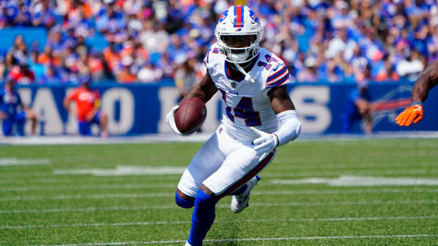 Aug 20, 2022; Orchard Park, New York, USA; Buffalo Bills wide receiver Stefon Diggs (14) runs with the ball after making a catch against the Denver Broncos during the first half at Highmark Stadium.