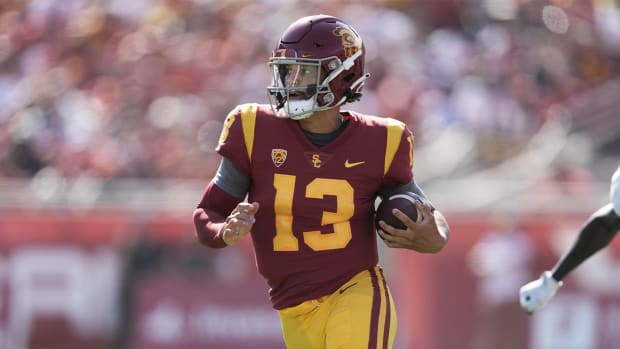 Sep 3, 2022; Los Angeles, California, USA; Southern California Trojans quarterback Caleb Williams (13) carries the ball against the Rice Owls in the first half at United Airlines Field at Los Angeles Memorial Coliseum.