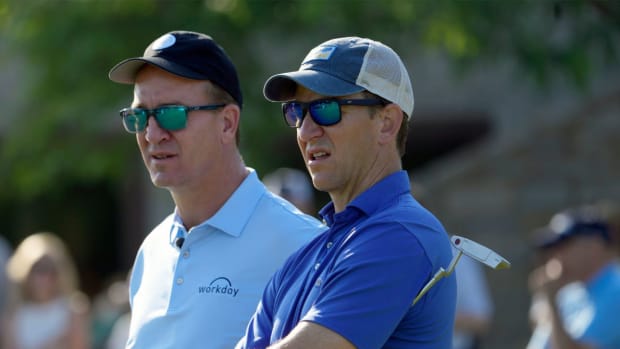 June 1, 2022; Dublin, Ohio, USA; Brothers and NFL players Peyton and Eli Manning warm up before competing in the Workday Golden Bear Pro-Am at the Memorial Tournament held at Muirfield Village Golf Club in Dublin, Ohio on June 1, 2022.