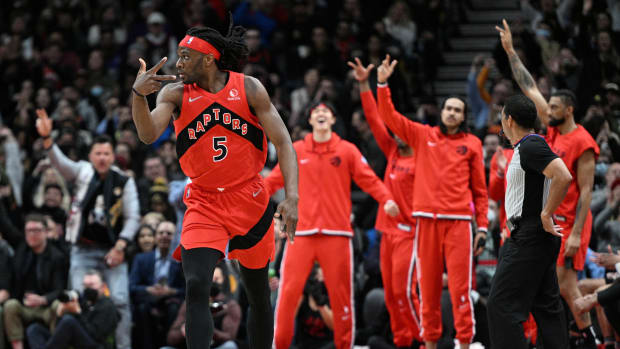 Toronto Raptors forward Precious Achiuwa (5) gestures as teammates react after scoring a three-point basket against the Minnesota Timberwolves in the first half at Scotiabank Arena