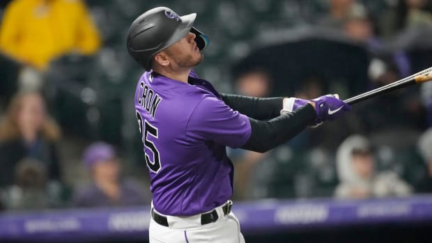 Rockies’ C.J. Cron flies out against Diamondbacks relief pitcher Caleb Smith in the eighth inning of Friday night’s game.