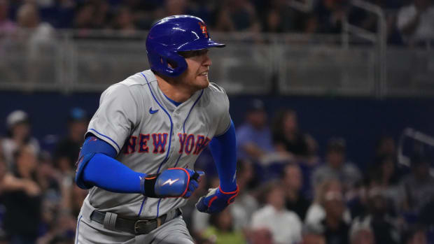 Sep 9, 2022; Miami, Florida, USA; New York Mets center fielder Brandon Nimmo (9) runs to first base after hitting a RBI single in the third inning against the Miami Marlins at loanDepot park.