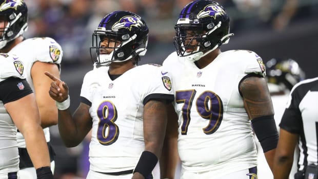 Ravens offensive tackle Ronnie Stanley and quarterback Lamar Jackson wait for a play call in a game vs. Las Vegas.