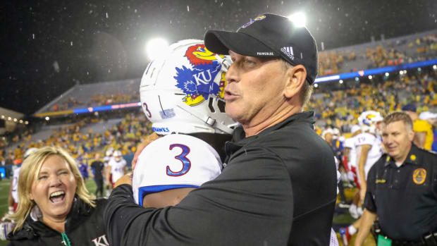 Jayhawks head coach Lance Leipold celebrates with cornerback Ra'Mello Dotson (3) after beating the West Virginia Mountaineers at Mountaineer Field at Milan Puskar Stadium. Mandatory Credit: Ben Queen-USA TODAY Sports