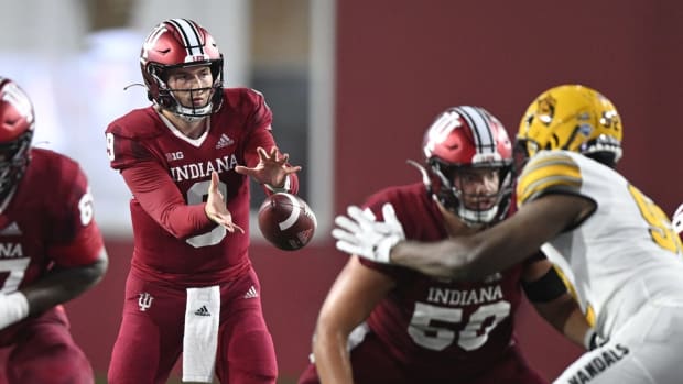 Sep 10, 2022; Bloomington, Indiana, USA; Indiana Hoosiers quarterback Connor Bazelak (9) takes the snap against the Idaho Vandals during the second half at Memorial Stadium. The Hoosiers won 35-22. Mandatory Credit: Marc Lebryk-USA TODAY Sports