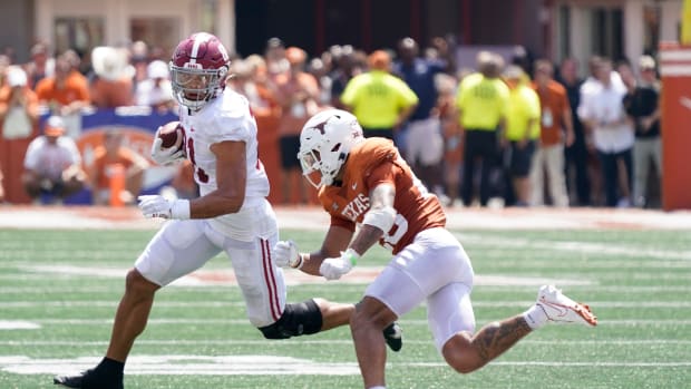 Alabama Crimson Tide tight end Cameron Latu (81) defended by Texas Longhorns defensive back Jerrin Thompson (28) after catching a pass during the second half at at Darrell K Royal-Texas Memorial Stadium.
