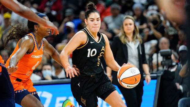 Aces guard Kelsey Plum drives the ball against Sun guard Nia Clouden during Game 2 of the WNBA Finals.