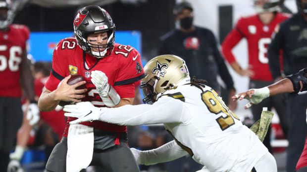 Tom Brady takes a sack in a 2020 game against the Saints.