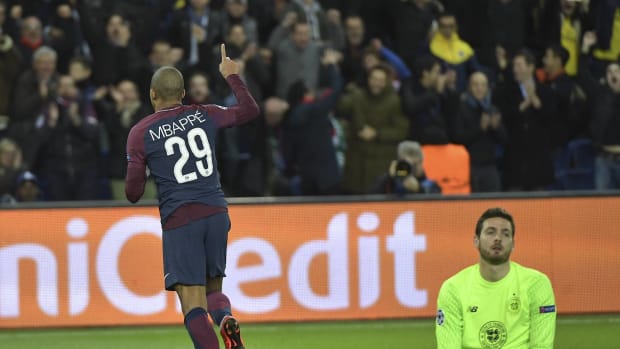 Kylian Mbappe pictured celebrating a Champions League goal for PSG against Celtic in 2017