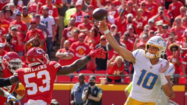 Sep 26, 2021; Kansas City, Missouri, USA; Los Angeles Chargers quarterback Justin Herbert (10) throws a pass as Kansas City Chiefs inside linebacker Anthony Hitchens (53) defends during the second half at GEHA Field at Arrowhead Stadium. Mandatory Credit: Denny Medley-USA TODAY Sports