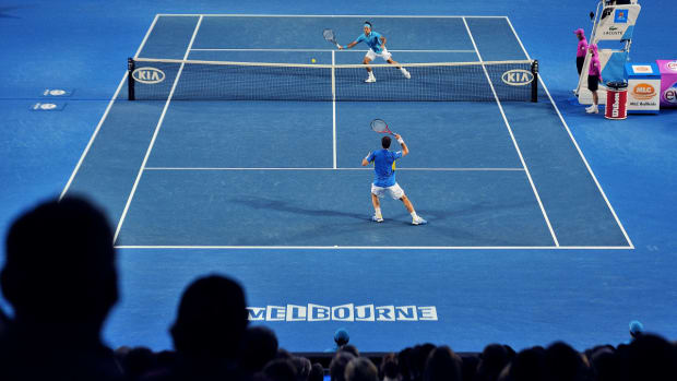 Roger Federer returns a shot against Andy Murray in the 2010 Australian Open final.