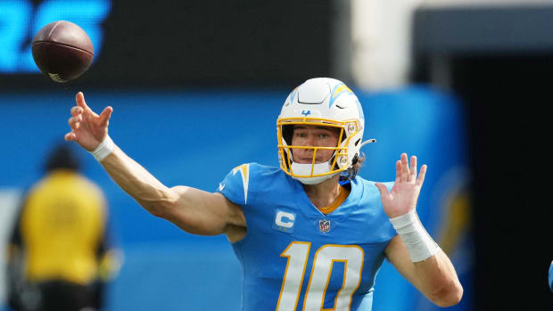 Sep 11, 2022; Inglewood, California, USA; Los Angeles Chargers quarterback Justin Herbert (10) throws the ball against the Las Vegas Raiders in the second half at SoFi Stadium. Mandatory Credit: Kirby Lee-USA TODAY Sports