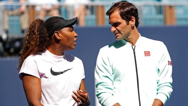 Williams speaks with Federer during a ribbon cutting ceremony on new stadium court at Hard Rock Stadium prior to play in the first round of the 2019 Miami Open.