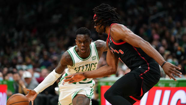 Boston Celtics guard Dennis Schroder (71) drives the ball against Toronto Raptors forward Precious Achiuwa (5) in the second half at TD Garden